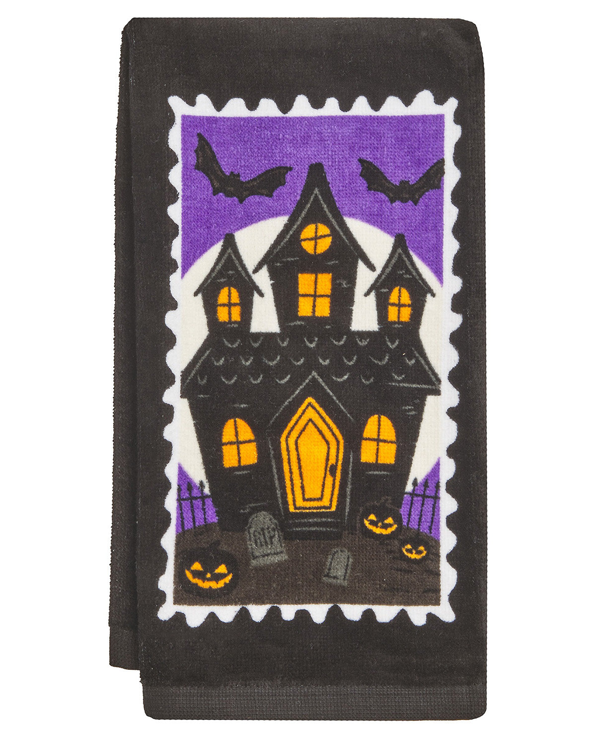 A dark charcoal gray towel featuring a large, colorful Halloween-themed postage stamp design with a haunted house, bats, pumpkins, and a purple sky.
