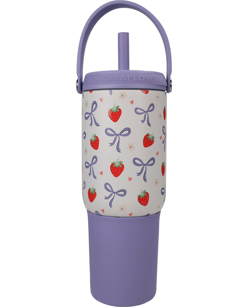 A purple HydraFlow insulated tumbler with a straw lid, featuring a white fabric sleeve printed with red strawberries and purple bows on a white background.