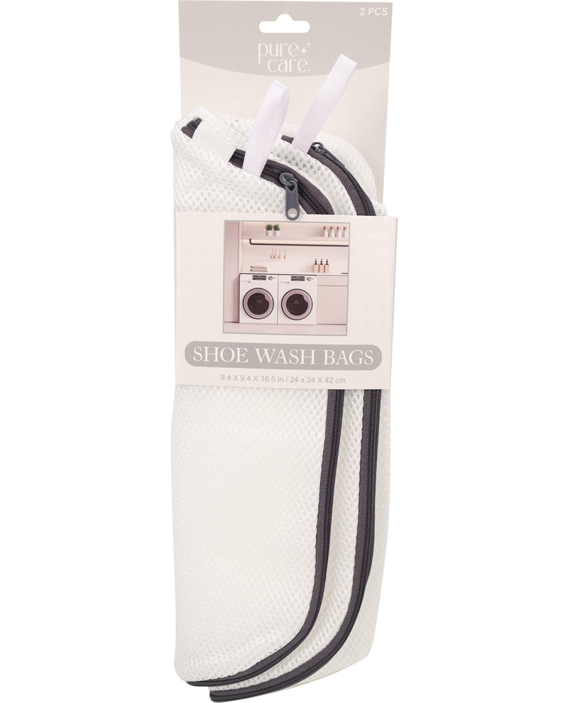 Pure+ Care shoe wash bags in a white mesh zippered pouch with black elastic bands, packaged on a white cardboard backing with a hanging tab.
