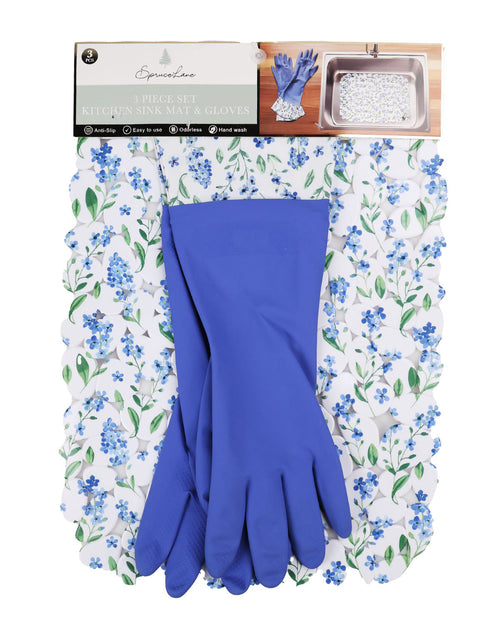Blue gloves on a floral-patterned mat with packaging in the background