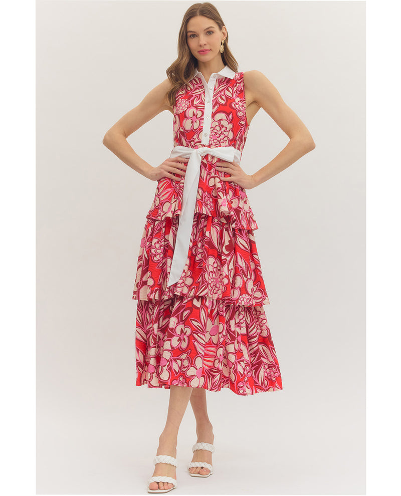 Woman wearing a red floral dress on a white background