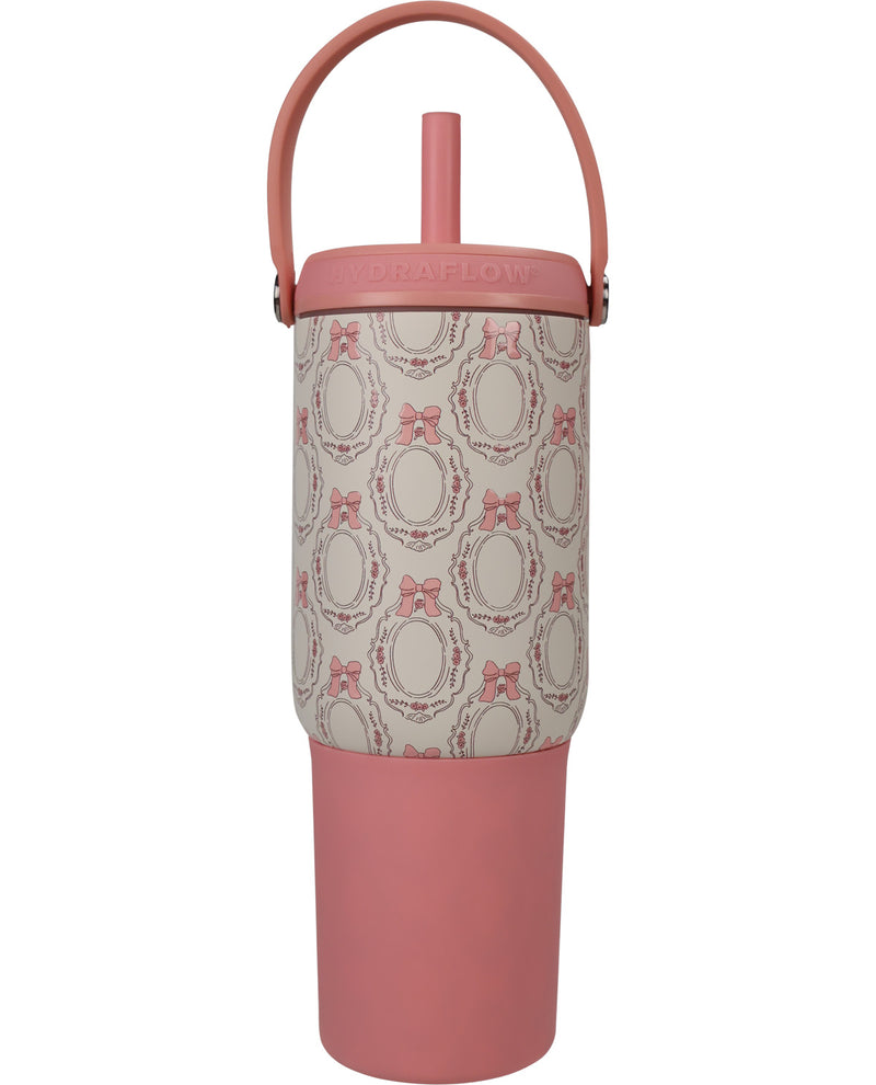 A pink and beige patterned insulated tumbler with a matching pink lid, carrying loop, and straw, shown on a plain white background.