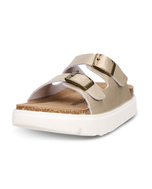 Gold sandal with gold straps on a white background