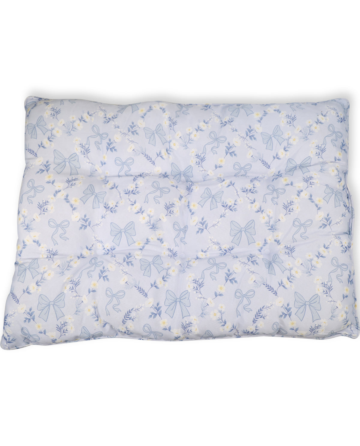 A square quilted cushion or pillow with a light blue and white floral pattern featuring bows and small yellow flowers, shown against a plain white background.