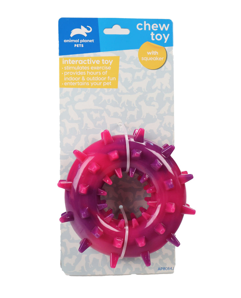 A pink and purple plastic chew toy for pets, packaged on a branded Animal Planet Pets backing card. The toy is a circular interactive squeaker with spikes around the edge and a white string attached.