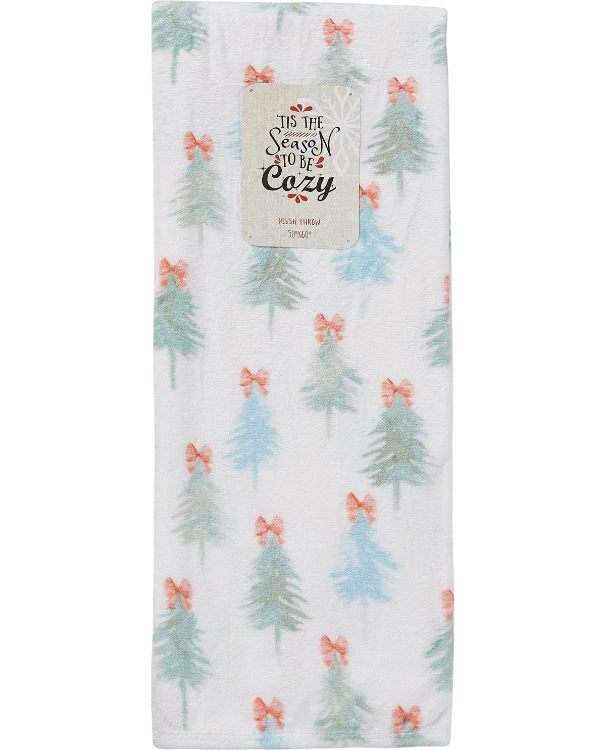 A plush fleece baby blanket featuring a repeating pattern of light blue Christmas trees and coral-pink bows on a white background, with a paper label that reads 'It's the Season to be Cozy'.