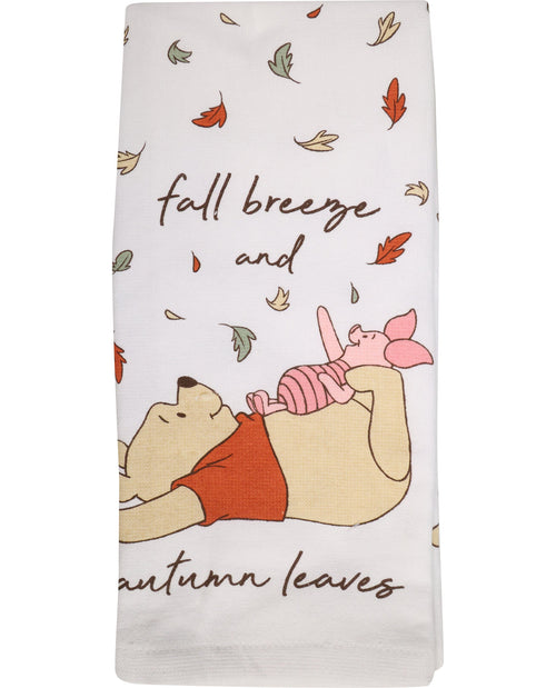 Towel with cartoon characters and autumn-themed text on a white background