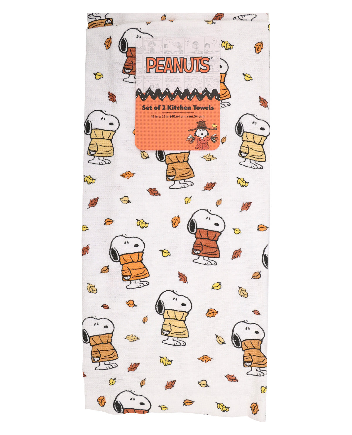 A set of three kitchen towels featuring a white background with a repeating pattern of Snoopy wearing an orange sweater, with scattered autumn leaves. The towels are packaged with an orange cardboard insert labeled 'SNOOPY PEANUTS Set of 3 Kitchen Towels'.