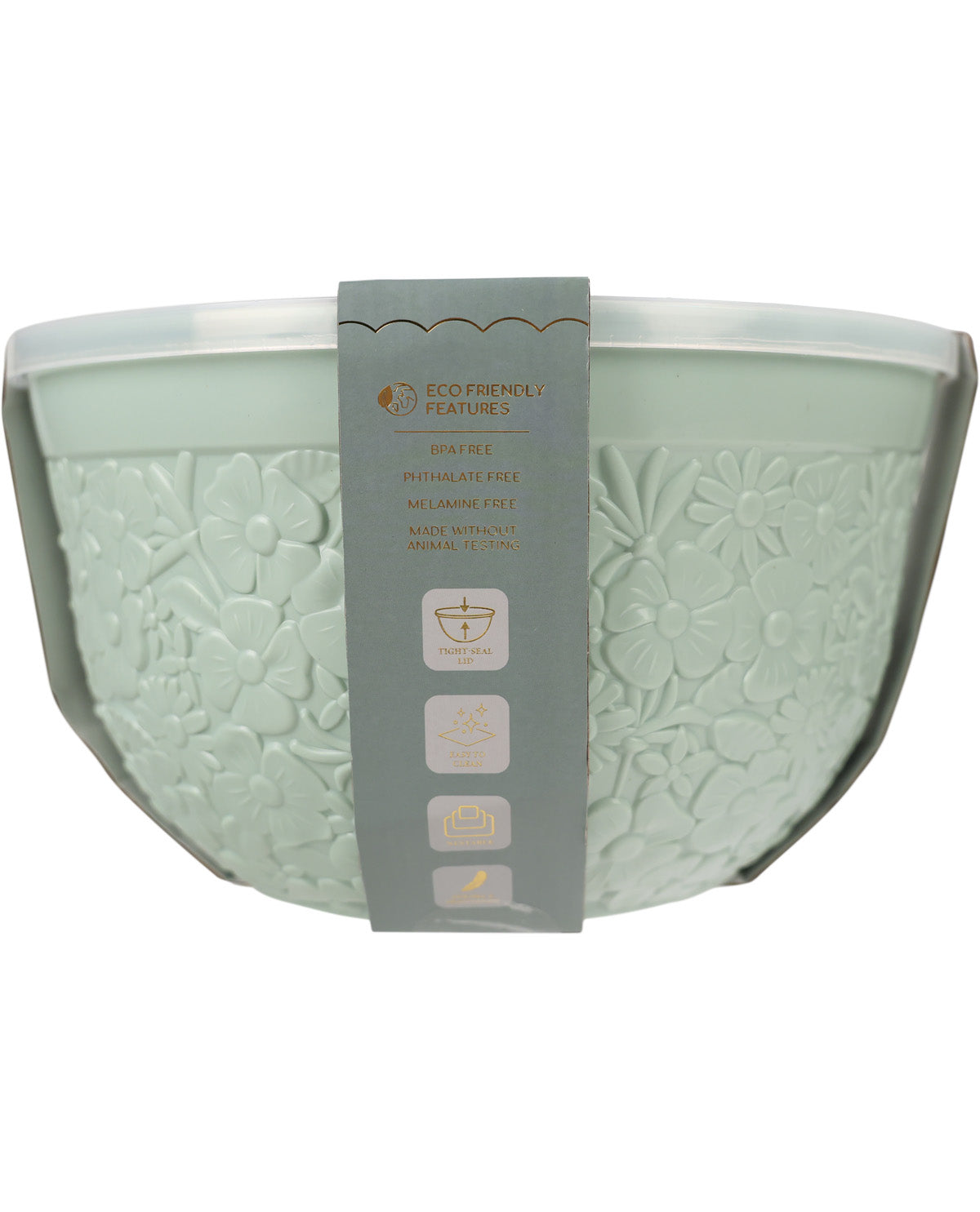 A light sage green glass mixing bowl with an embossed floral pattern, featuring a gray paper band label wrapped around the center.
