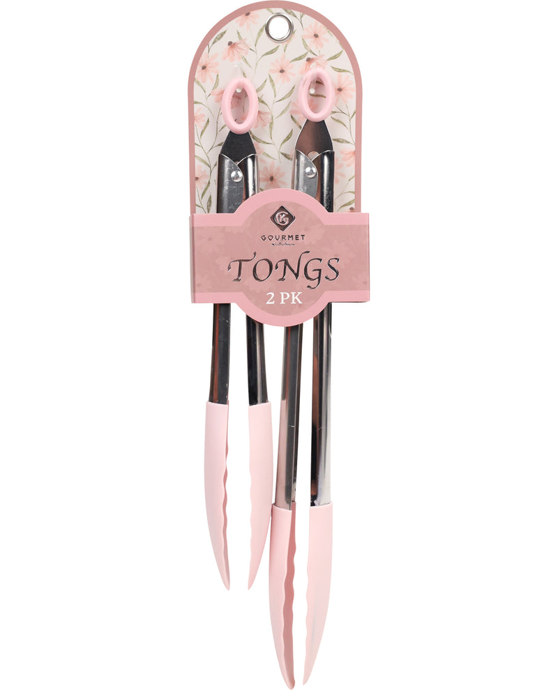 Set of pink tongs in a decorative packaging with floral design on a white background