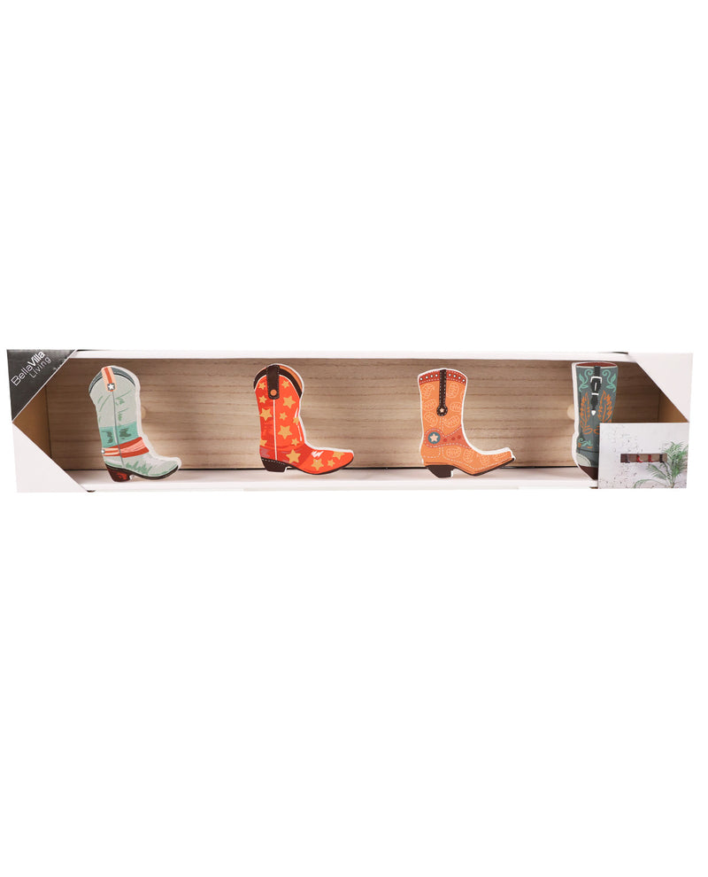 A set of three cowboy boot-shaped decorative items displayed inside an open wooden presentation box on a white background.