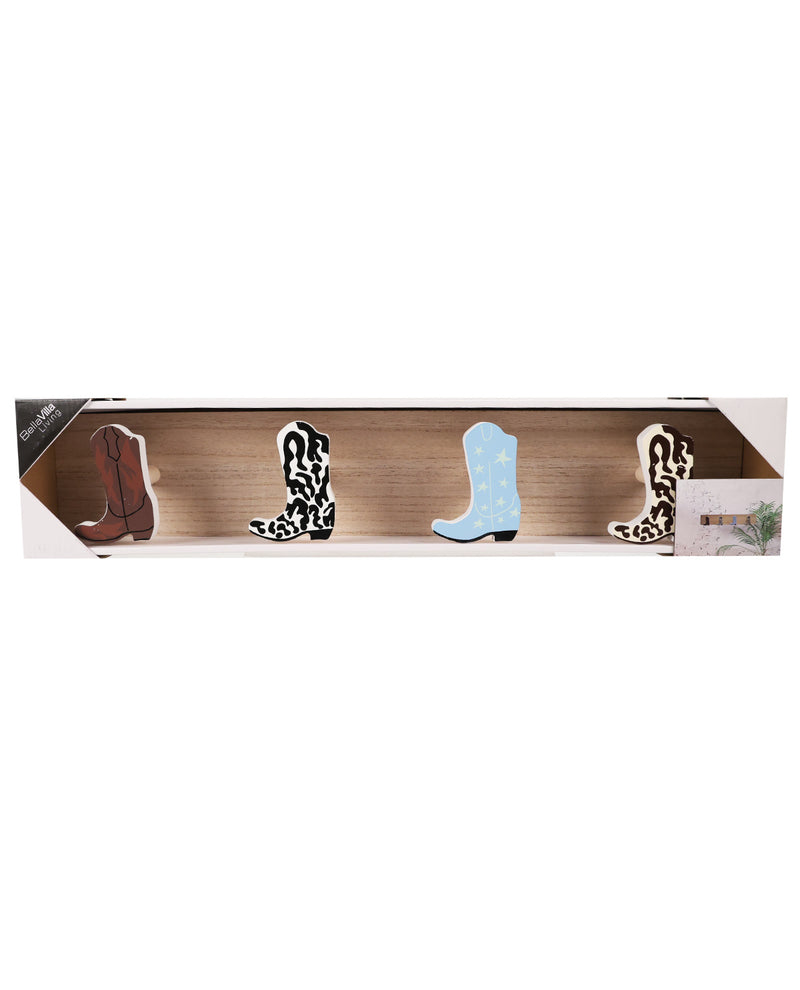 A set of four decorative cowboy boot cutouts displayed in a clear windowed wooden box. The set includes one brown boot, one black and white leopard print boot, one light blue boot with white polka dots, and one black and white leopard print boot.