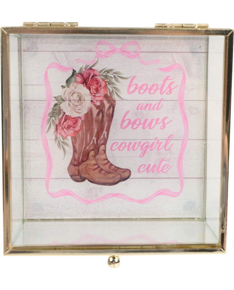 Decorative box with a cowboy boot, flowers, and 'boots and bows cowgirl cute' text on a wooden background.