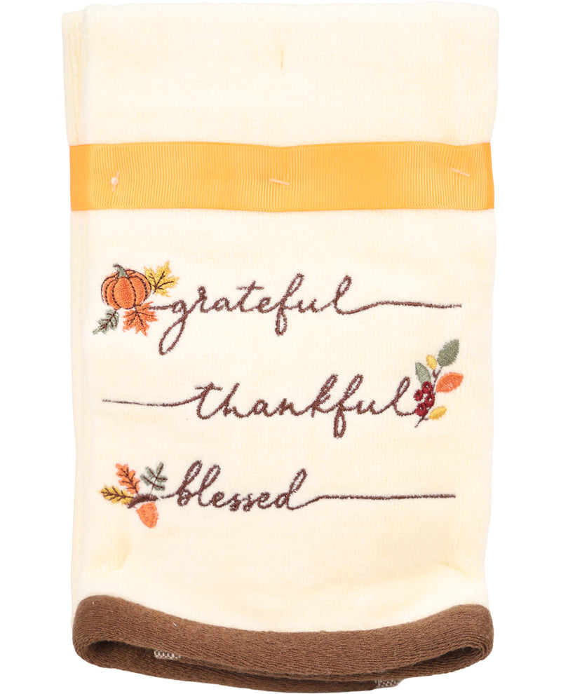Decorative towel with 'grateful', 'thankful', 'blessed' text and pumpkins on a white background