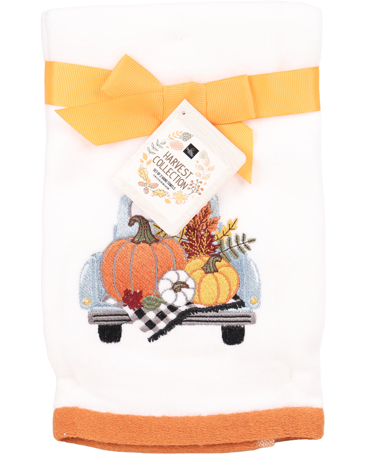 Decorative towel with pumpkins and a truck design, featuring a brand tag on a white background.