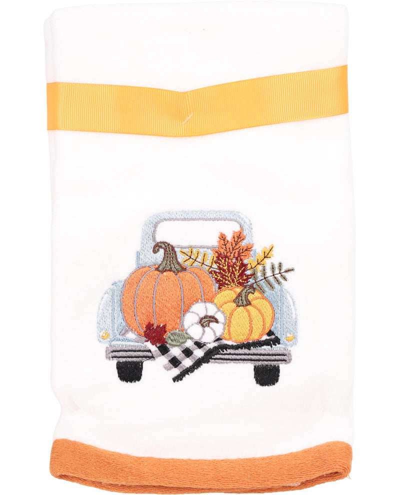 Decorative towel with pumpkins and a truck design on a white background
