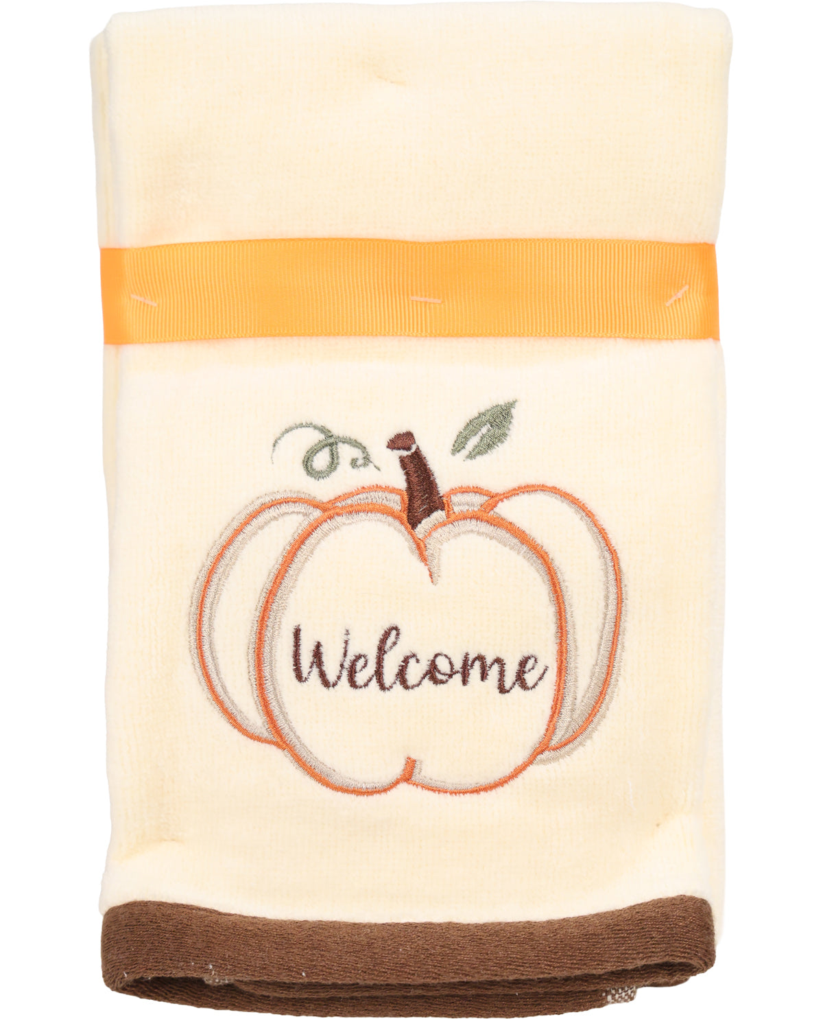 Folded towel with pumpkin design and 'Welcome' text on a white background