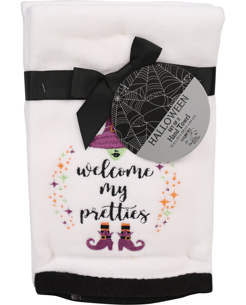 Halloween-themed hand towel with decorative text and graphics on a white background