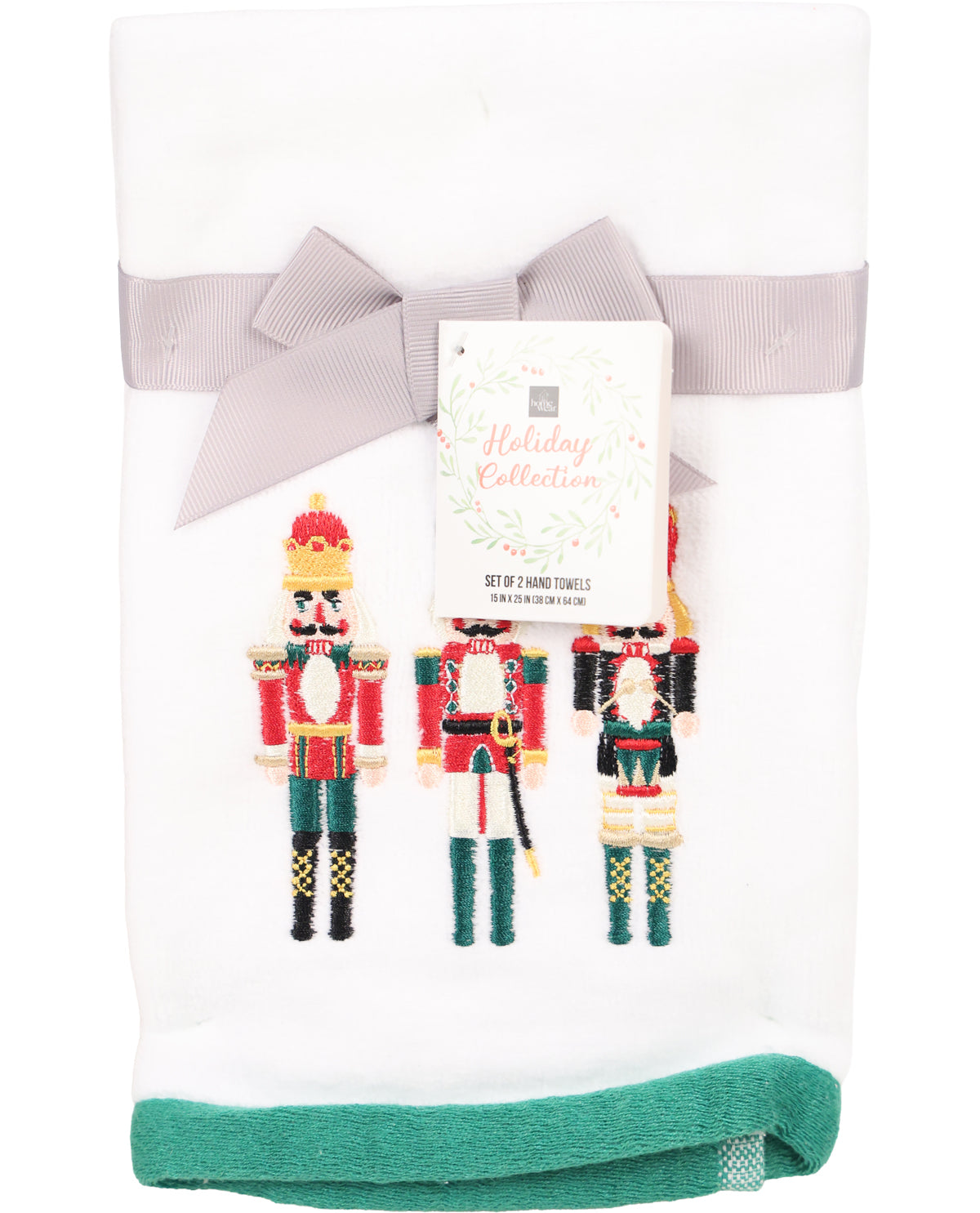 Set of three nutcracker-themed hand towels with a decorative bow on a white background