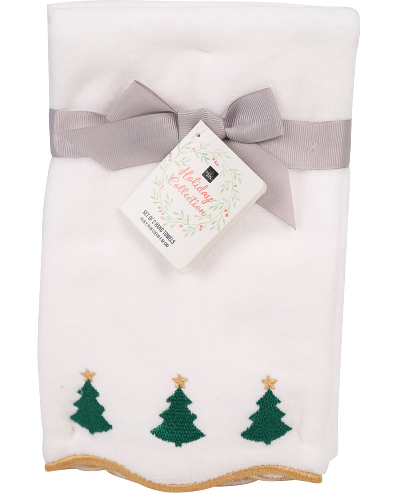 White towel with green tree patterns and a gray bow, featuring a product card on a white background.