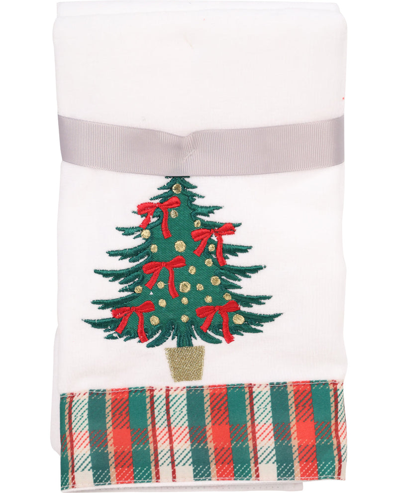 Decorative towel with a Christmas tree design and red bows on a white background