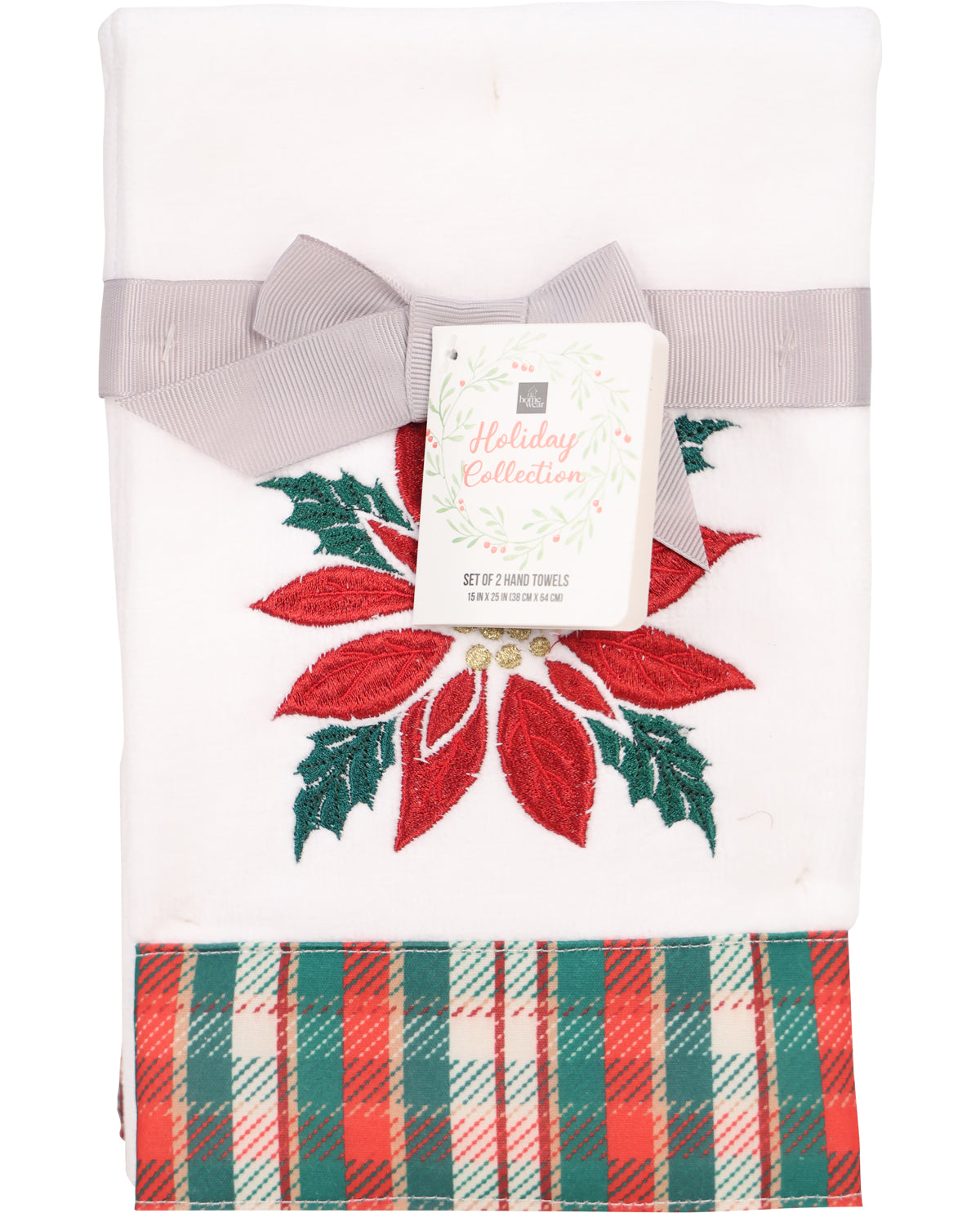 Decorative towel with poinsettia design and plaid pattern, featuring a brand tag.