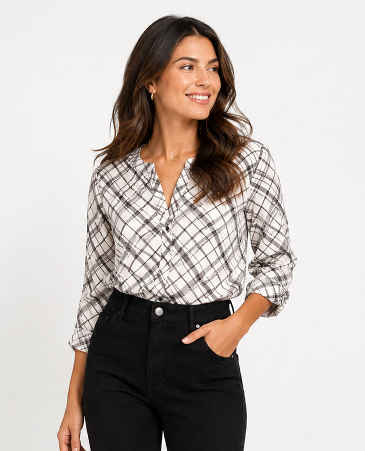 Woman wearing a plaid shirt and black pants on a white background