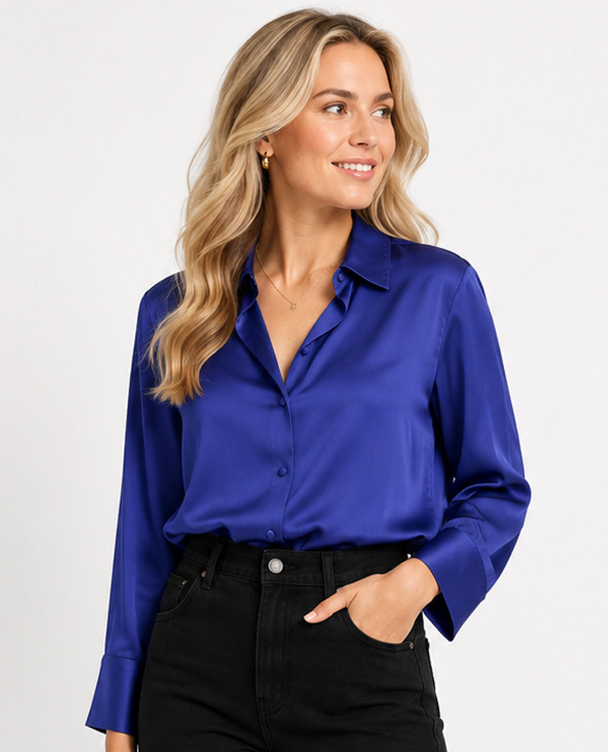 Woman wearing a blue satin shirt against a white background