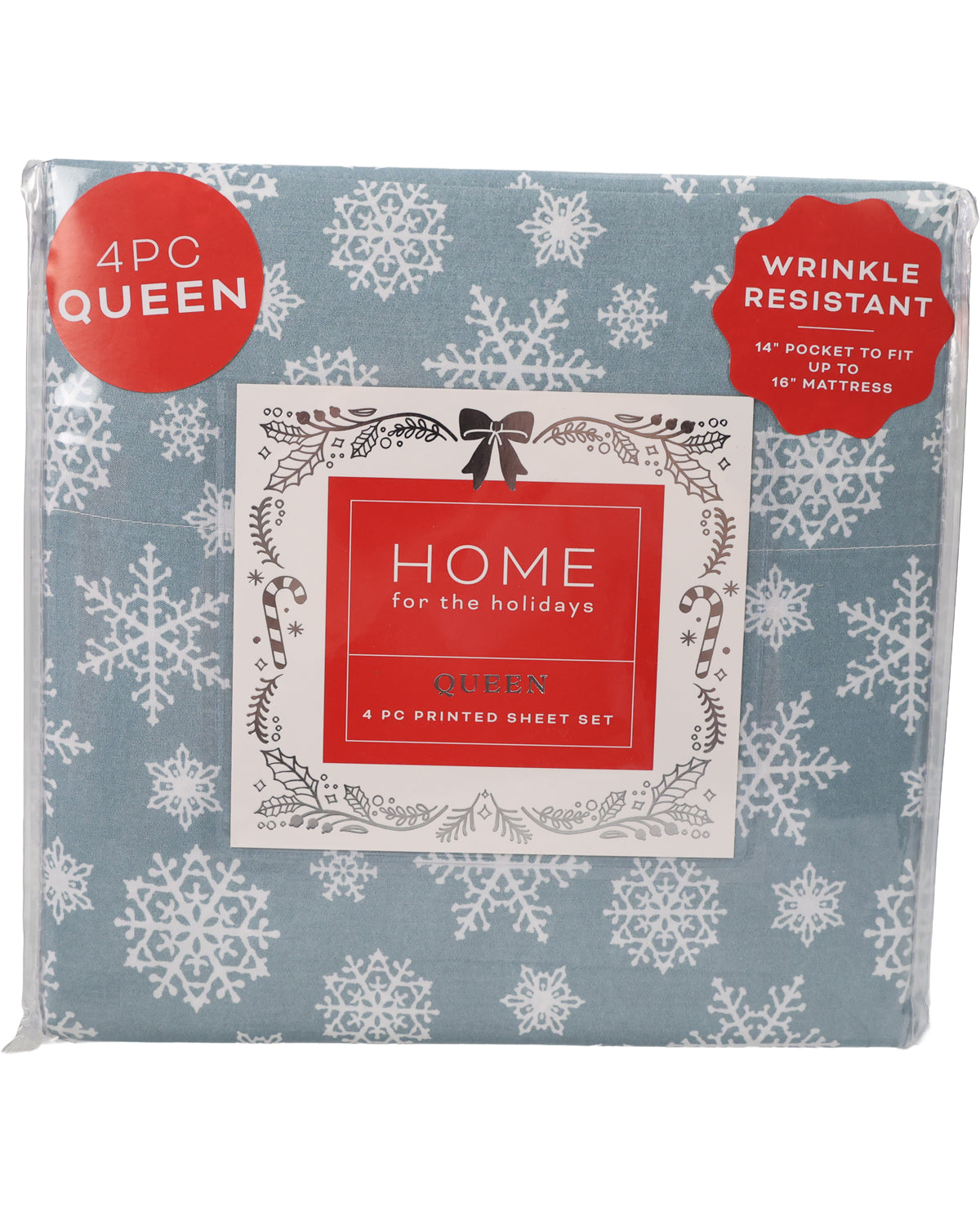 A packaged 4-piece sheet set with a dusty blue background and white snowflake pattern, featuring a red and white 'HOME for the holidays' label on the front.