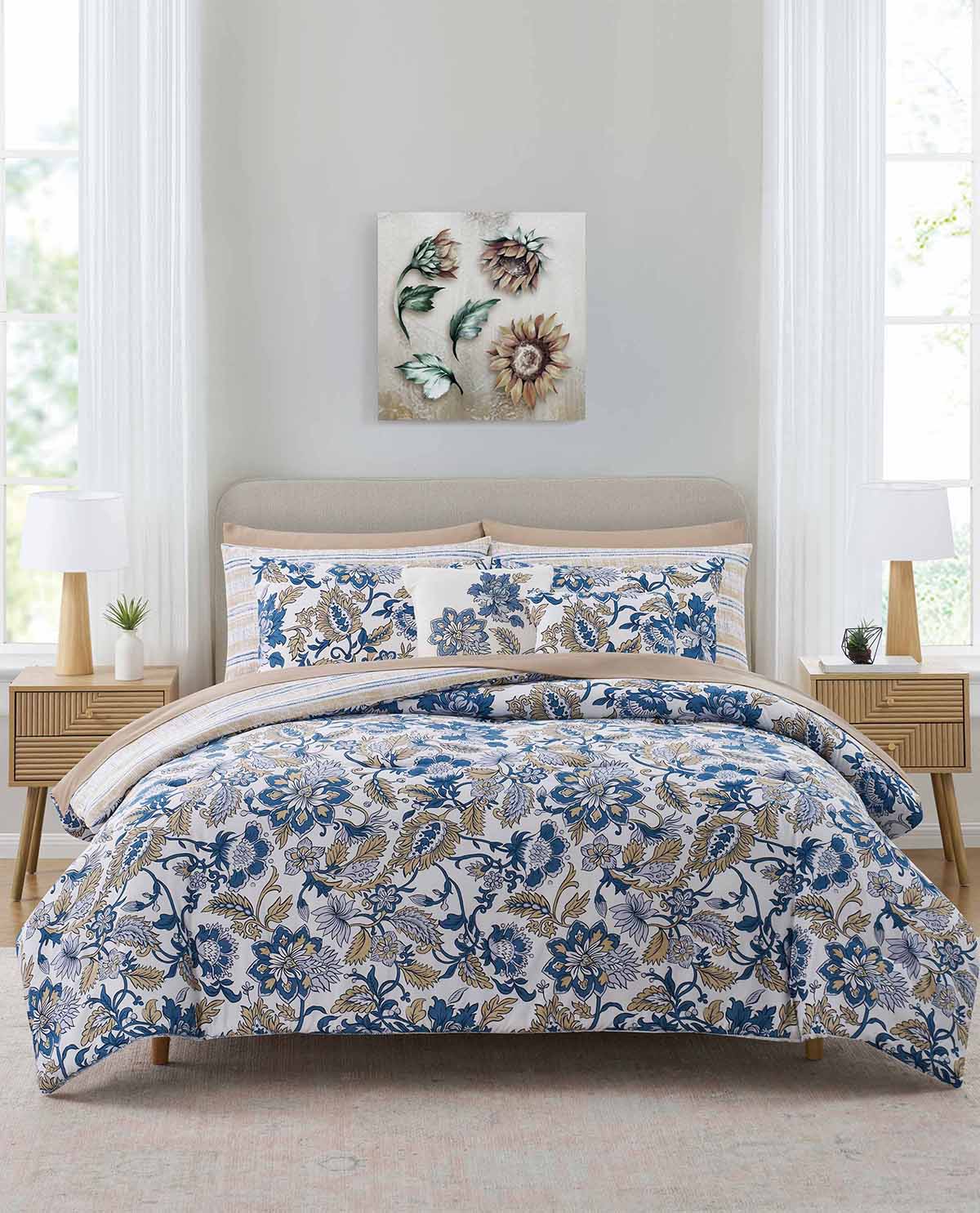 Bedroom with floral bedding set on a bed, two nightstands, and a wall art piece.