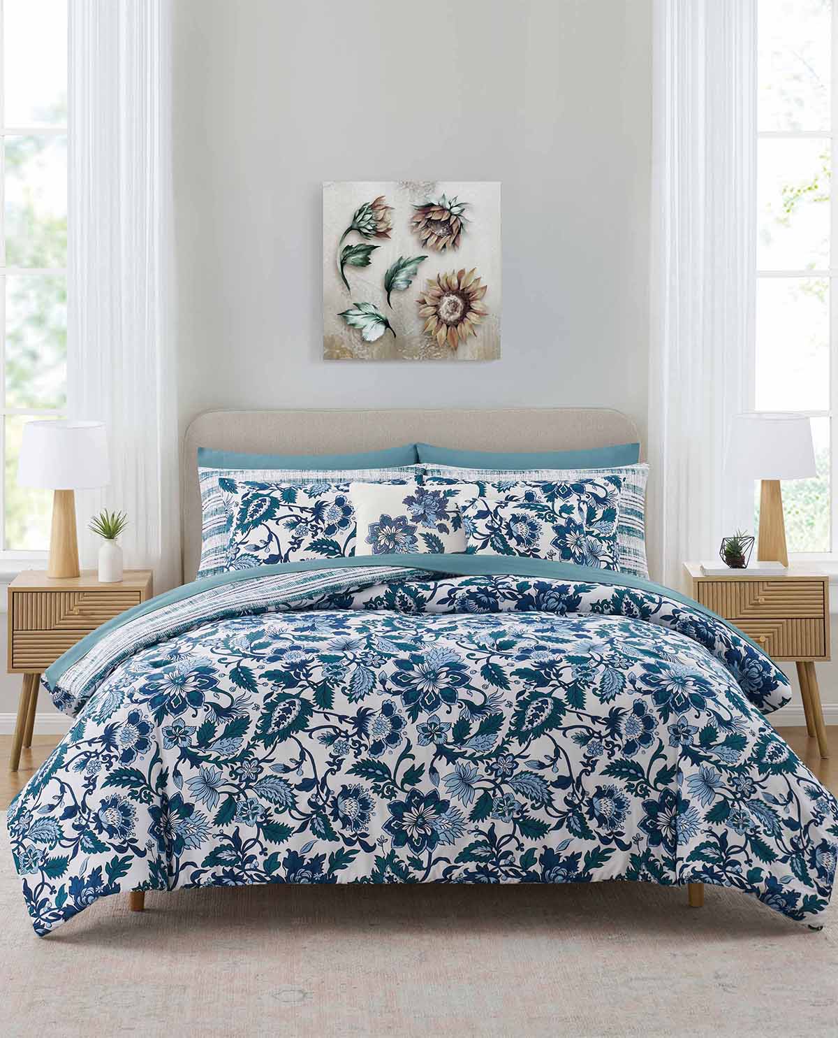 Bedroom with floral bedding set and decorative wall art.