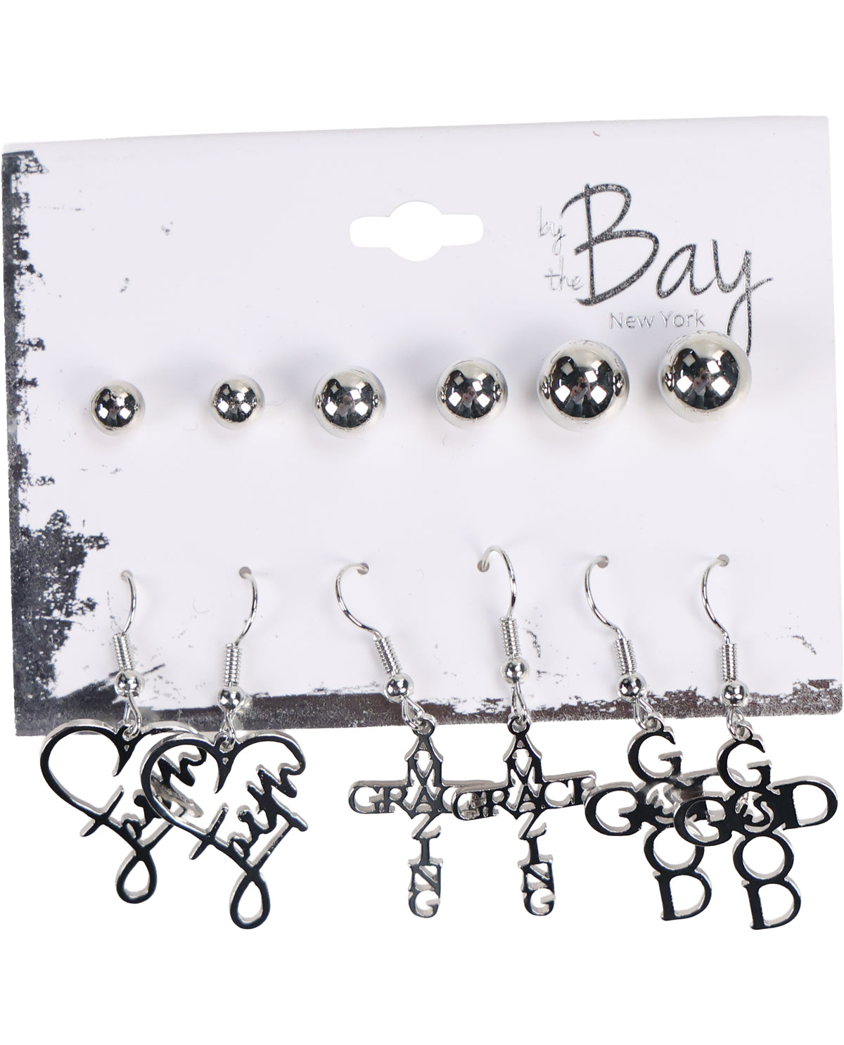 A set of silver-toned earrings displayed on a white branded card backing. The top row shows five small round stud earrings, and the bottom row shows five dangling hook earrings with script and monogram designs including 'love', 'grace', 'faith', 'good', and 'God'.