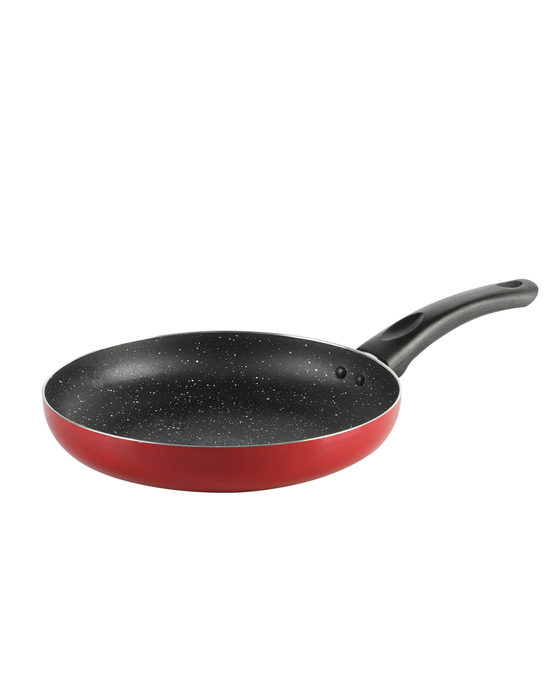 Red frying pan with black speckled interior on a white background
