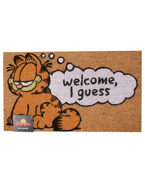 A rectangular coir doormat featuring Garfield sitting on the left with a thought bubble that reads 'welcome, I guess'. The doormat is brown with orange, black, and white details, and a small Garfield brand tag is attached in the lower left corner.