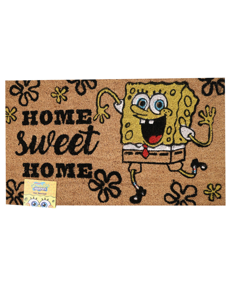 A rectangular coir doormat featuring SpongeBob SquarePants waving and the words 'HOME sweet HOME' in black lettering, with black flower motifs around the border. A small SpongeBob branded tag is attached at the lower left.