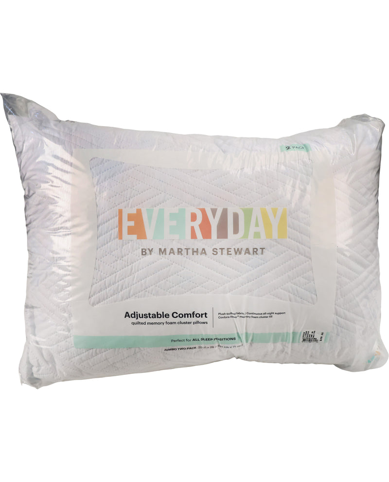 A white quilted pillow from Everyday by Martha Stewart, shown in its clear plastic packaging with the brand logo and product details printed on the front.