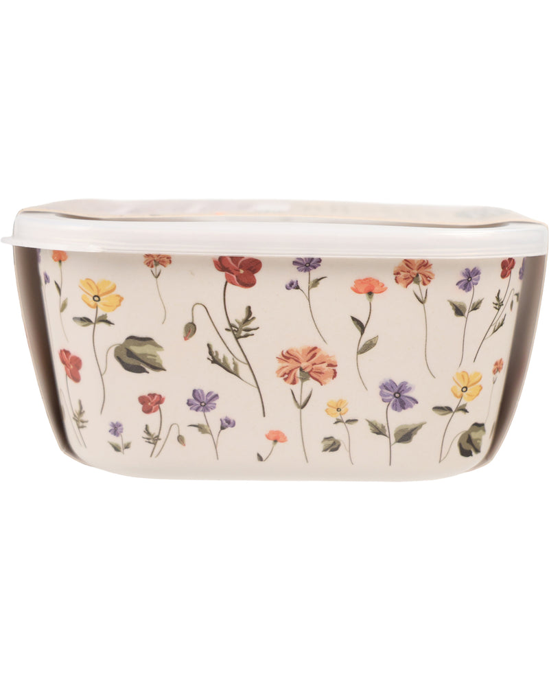 A rectangular ceramic container with a white lid, featuring a delicate multicolor floral pattern on a warm cream background.