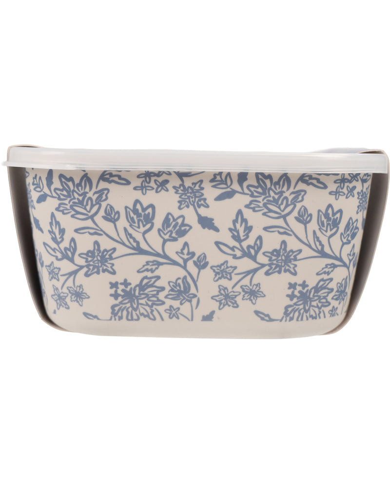 A rectangular ceramic baking dish with a white interior and a blue floral pattern on the exterior, shown against a plain white background.