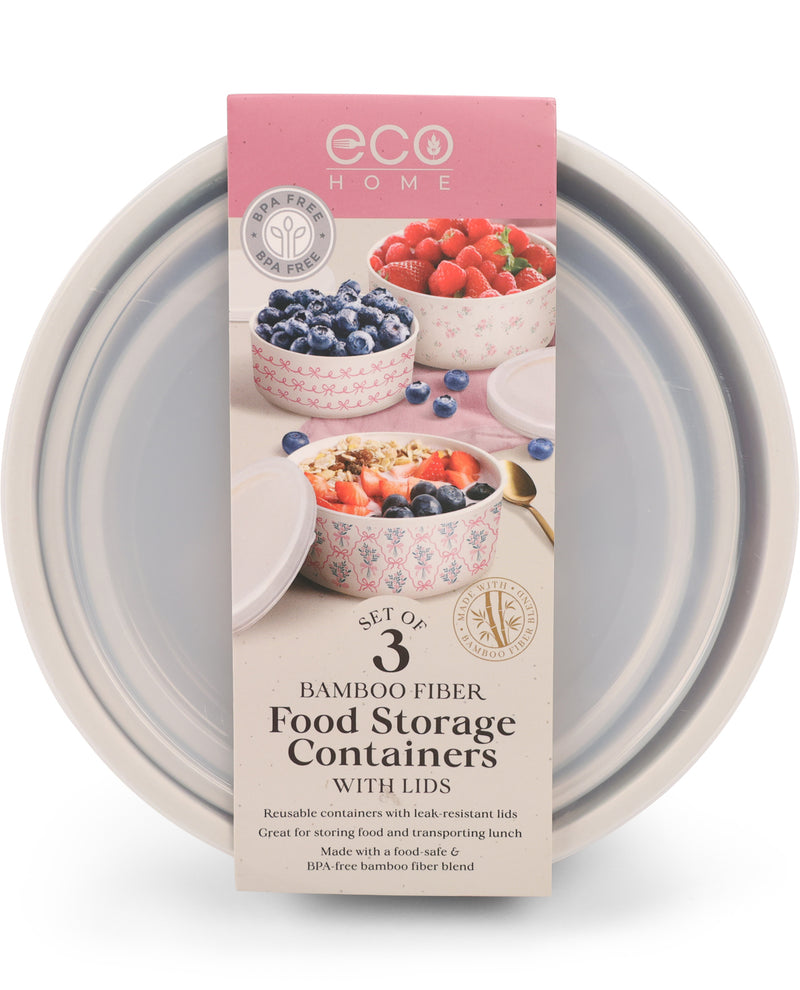 A set of three Eco Home bamboo fiber food storage containers with lids, shown in their retail packaging box. The packaging features a pink header and displays images of the containers filled with berries and cereal.
