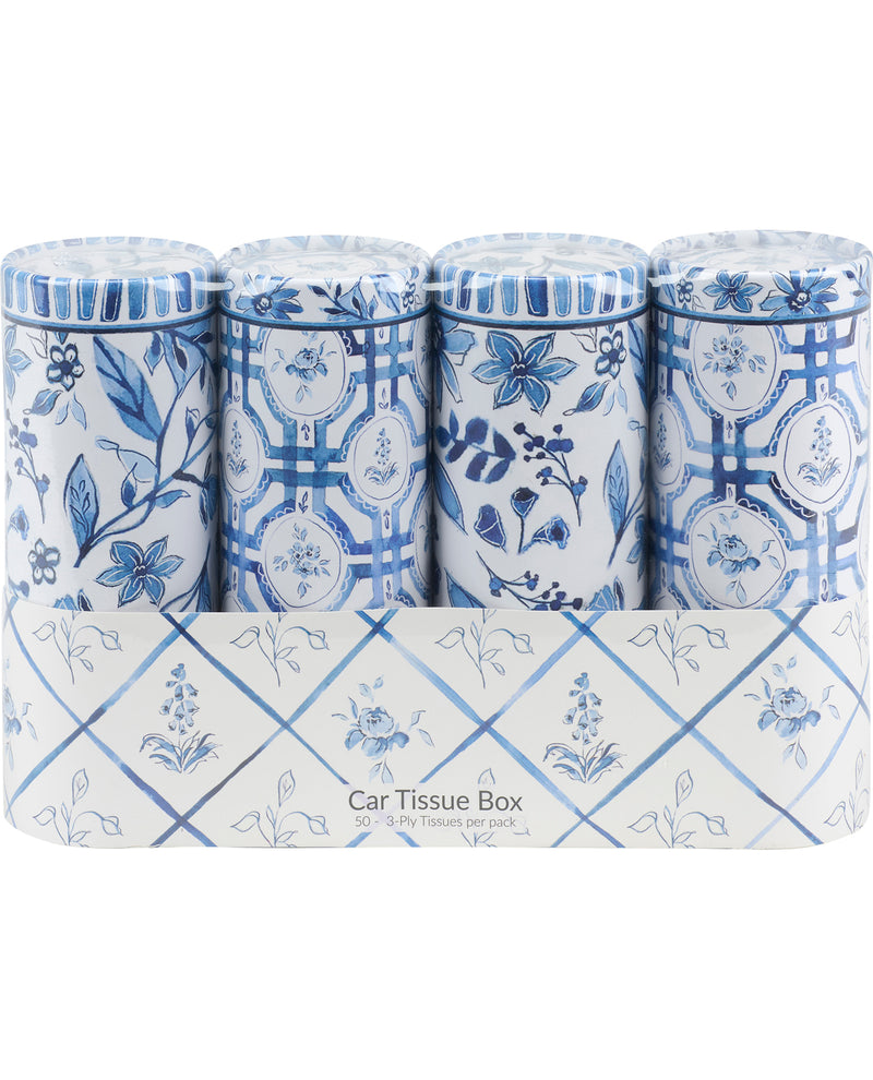 Set of blue and white patterned tissue boxes on a white background