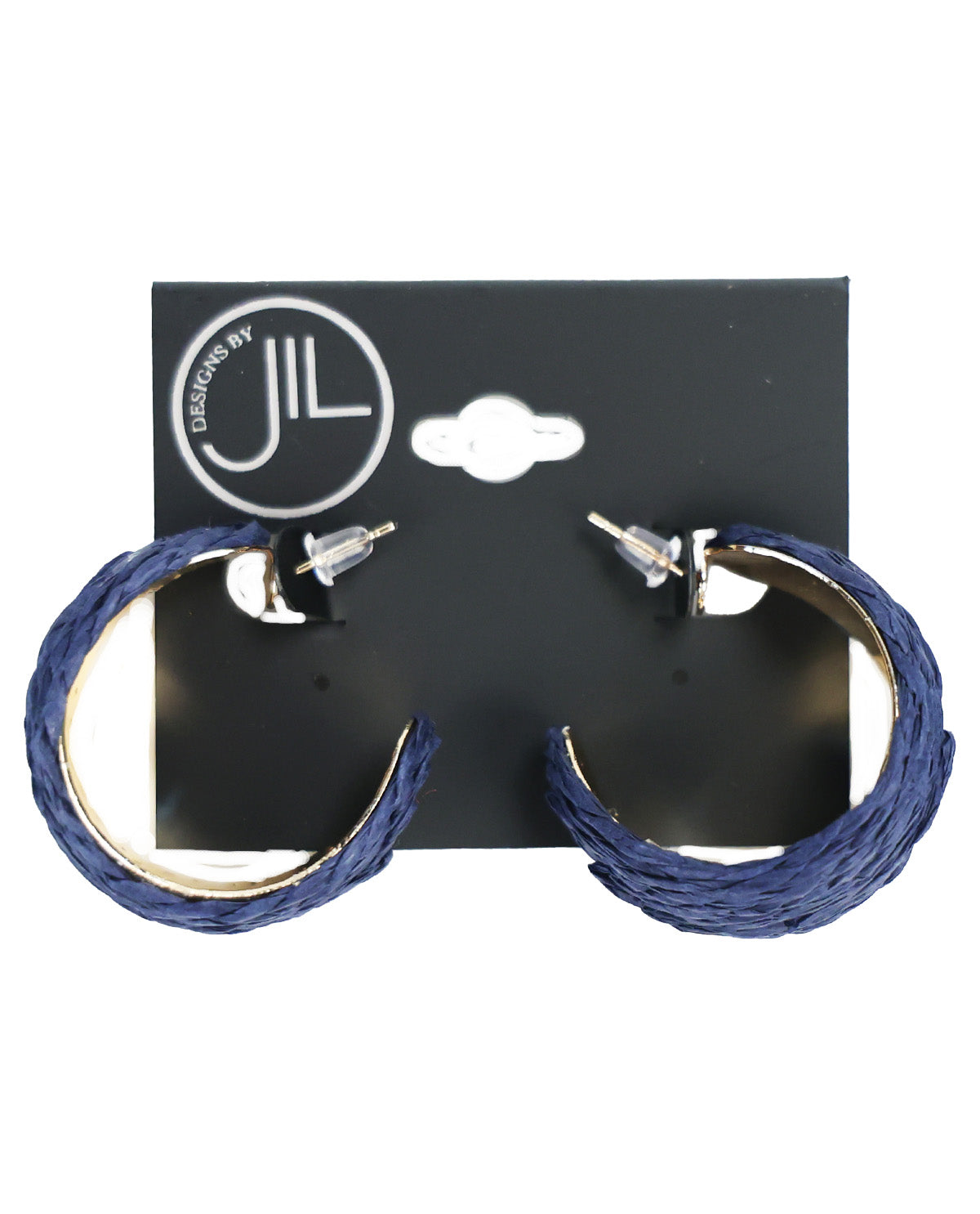 A pair of thick, textured blue hoop earrings with silver-tone posts, displayed on a black hanging card featuring the 'JIL DESIGNS BY' logo, set against a plain white background.