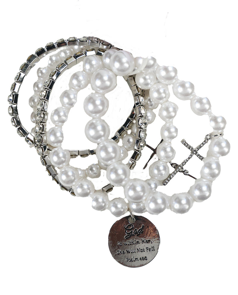 A stack of beaded stretch bracelets featuring white faux pearls, silver-toned rhinestone bands, and a silver-toned cross charm with a round engraved medallion.