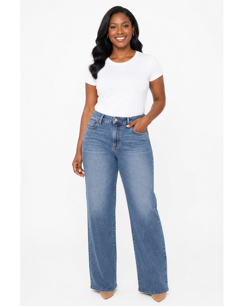 Woman model wearing long denim wide leg jeans with a white tee with white background