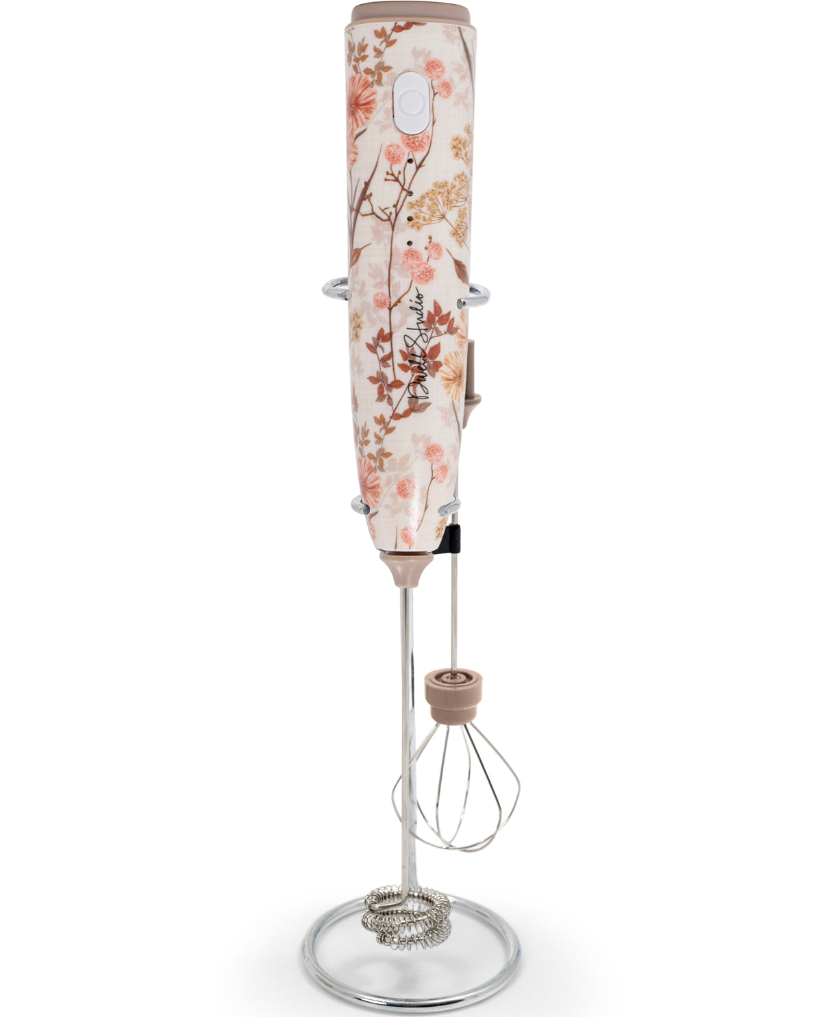 Handheld blender with floral design on a white background