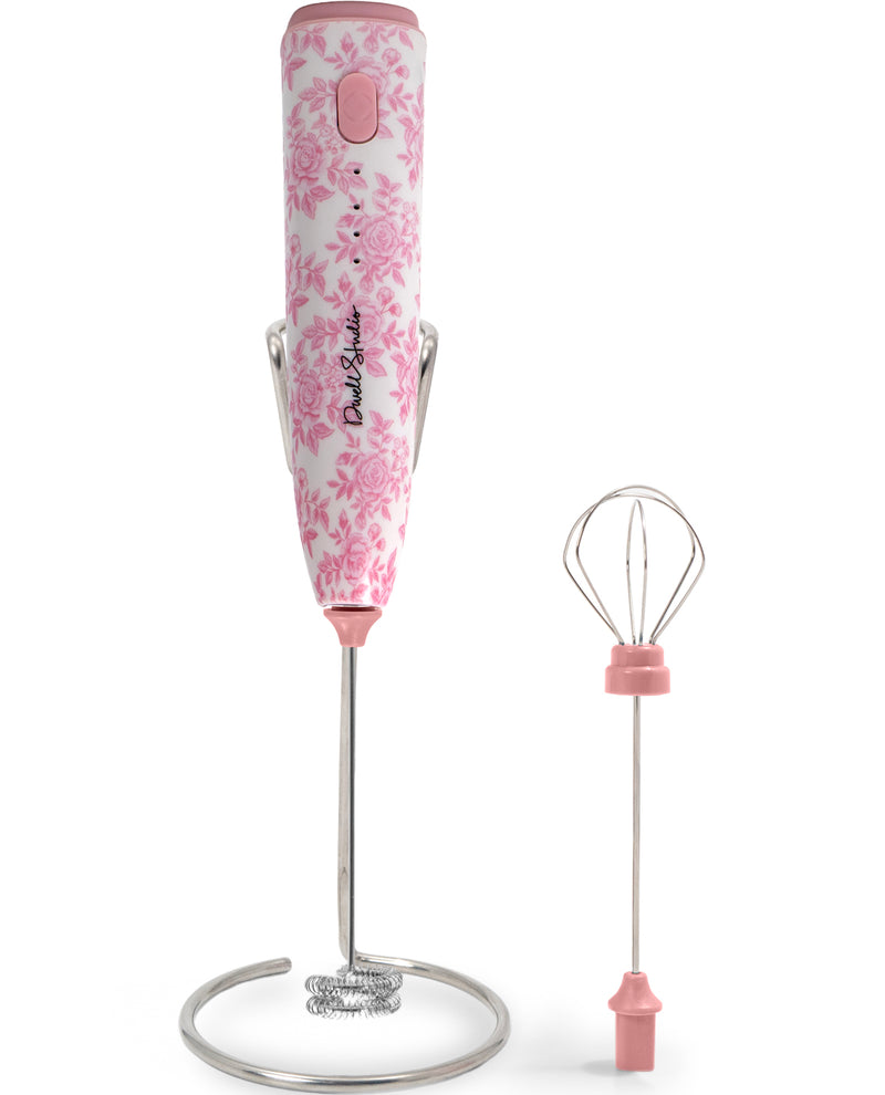 Pink floral-handled immersion blender with whisk attachment on a white background