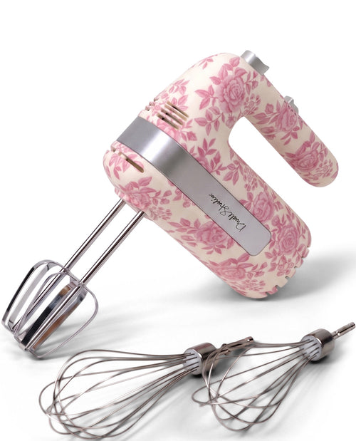 Hand mixer with floral patterned handle on a white background