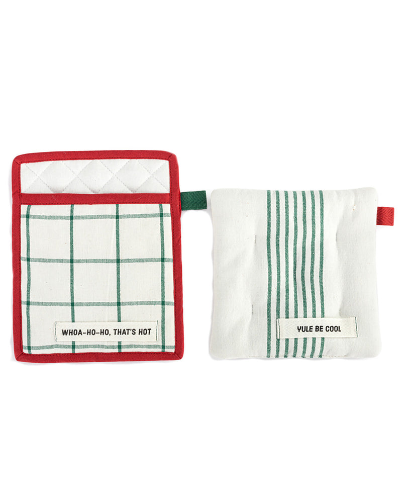 Two white kitchen towel potholders with green stripes and red trim, displayed side by side on a white background. The left one features a green plaid pattern and the text 'WHOA-HO-HO, THAT'S NOT', while the right one has green vertical stripes and the text 'VUE BE COOL'.