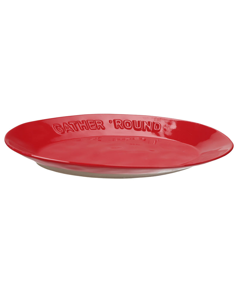 A red oval serving platter with the words 'GATHER 'ROUND' embossed on the rim, shown against a plain white background.