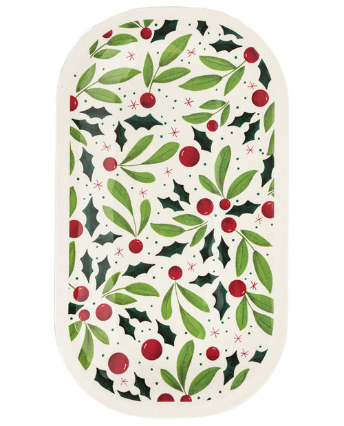 An oval decorative plate or tray featuring a festive Christmas holly pattern with green leaves, red berries, and dark green holly leaves on an off-white background.