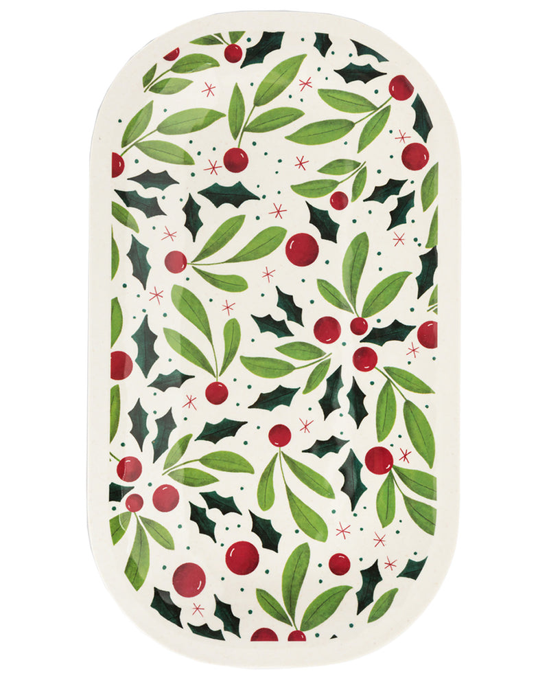 An oval decorative plate or tray featuring a festive Christmas holly pattern with green leaves, red berries, and dark green holly leaves on an off-white background.